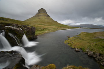 Famous kirkjufell mountain with the kirkjufell falls waterfalls in front in Grundarfjödur in Iceland