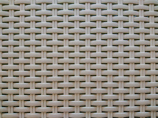 Laundry basket mesh texture, background beige.