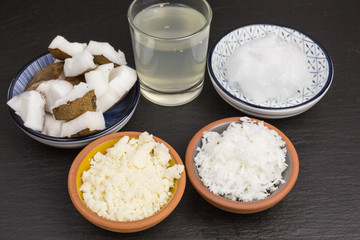 variety of coconut products: milk, puree, pieces, oil, flakes and pieces of coconut