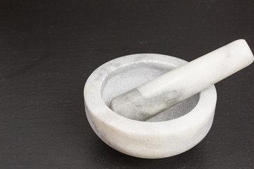 white and grey marble mortar and pestle