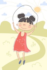 Happy little girl jumping over a skipping rope