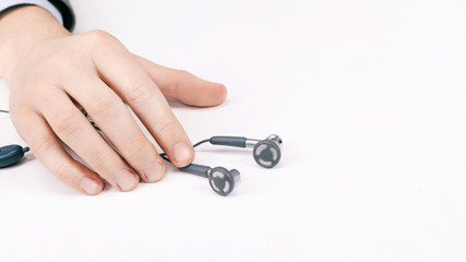 close-up of the earphone in the hands of men