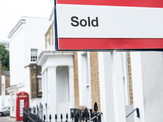 Estate agent 'Sold' sign on British street