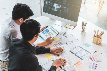 Young startup ux ui front end designers developing programming and coding responsive web content or...