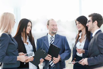 close up.a business team standing talking in the office