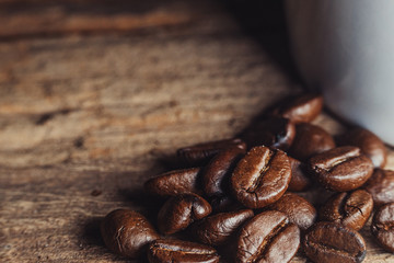Close-up shot of Coffee beans on wood background.