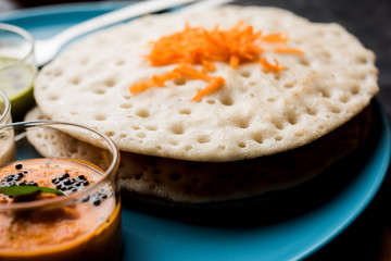 Set Dosa / Oothappam style dosa is a popular south Indian food served with sambar and chutney, selective focus