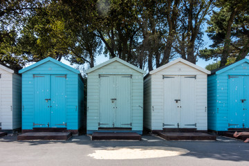 Fototapeta na wymiar Beach huts at Avon Beach in Mudeford, Dorset, UK