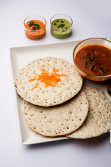 Set Dosa / Oothappam style dosa is a popular south Indian food served with sambar and chutney, selective focus