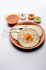 Set Dosa / Oothappam style dosa is a popular south Indian food served with sambar and chutney, selective focus