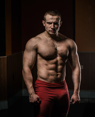 Fototapeta na wymiar Portrait of a bodybuilder on a black background