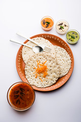 Set Dosa / Oothappam style dosa is a popular south Indian food served with sambar and chutney, selective focus