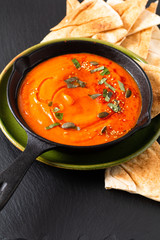 Healthy food concept Homemade pumpkin hummus in skillet iron pan with copy space