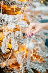 Decorated Christmas tree on blurred background.