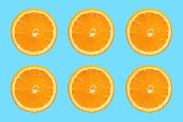 Juicy orange slice on blue background. Sliced ​​Citrus Fruits