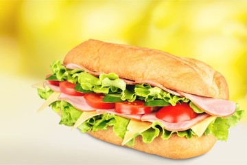 Ham and cheese salad submarine sandwich from freshly cut baguette