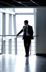 Fototapeta na wymiar successful businessman standing in the lobby of a modern office