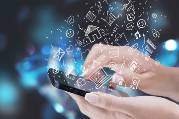 Hands holding smartphone  on background