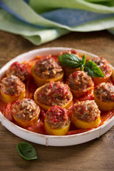 Zucchini stuffed with meat, rice and vegetables in tomato sauce. Loaded zucchini