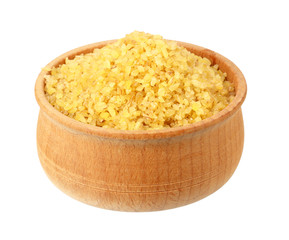 dry bulgur wheat in wooden bowl isolated on white background. top view