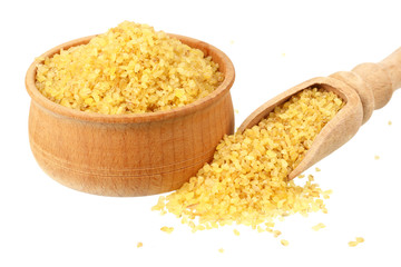 dry bulgur wheat in wooden bowl isolated on white background. top view