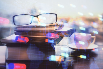 Data tech hologram with glasses on the table background. Concept of technology. Double exposure.