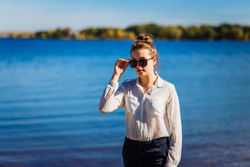 Stylish teen girl in the background of the sea