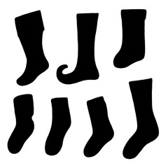 Different warm winter, christmas socks silhouettes on white background