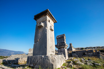 Fototapeta na wymiar Xanthos Ancient City. Grave monument and the ruins of ancient city of Xanthos - Letoon (Xantos, Xhantos, Xanths) in Kas, Antalya/Turkey. Capital of Lycia.