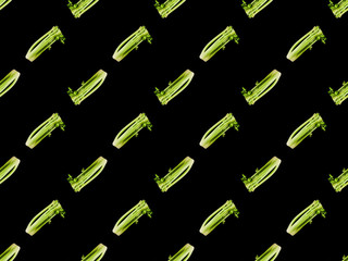 green organic whole leek isolated on black, seamless background pattern