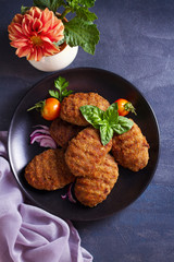 Delicious homemade burgers or patties and vegetables. View from above, top studio shot