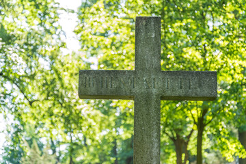 Closeup shot of grave cross at an old cemetery