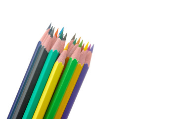 Many color pencils on white isolated background. close-up. stationery.