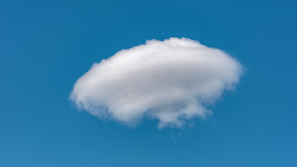 Blue sky with white clouds close up in the summertime