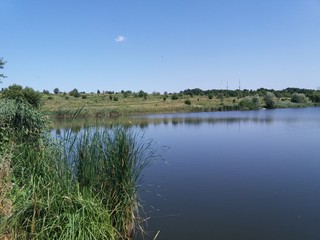 landscape with lake and blue sky