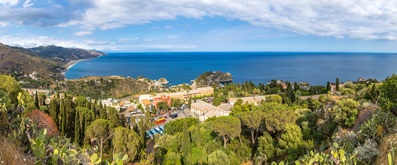 Panoramic aerial view of Giardini-Naxos bay and Ionian sea coast near Isola Bella island and Taormina town, Sicily, Italy - obrazy, fototapety, plakaty