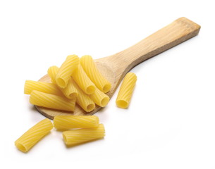 Uncooked short tubes shape pasta in wooden spoon,  tortiglioni or elicoidali isolated on white background