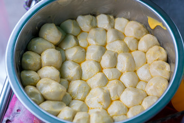The ingredients of Roti Making, white raw Roti thresh flour by maker. Indian traditional street food. Cooking roti or Indian food made of flour.Thailand street food. The dough is placed in a beautiful
