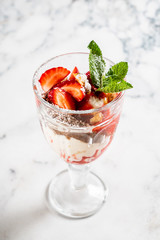 summer dessert with strawberries and ice cream
