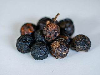 Sapindus rarak (lerak) on white background. In Indonesia lerak is used to wash batik.
