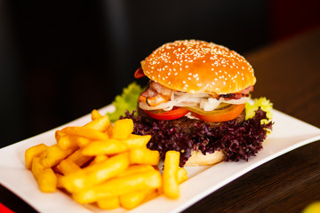 Close Up of Burger with Fries on table in Bistro
