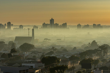 Sunrise with morning haze over the city