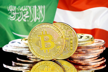 Concept for investors in cryptocurrency and Blockchain technology in the Saudi Arabia and Austria. Bitcoins on the background of the flag Saudi Arabia and Austria.
