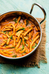 Dhaba style Sev bhaji/sabzi/curry made in tomato curry with gathiya shev, served in a bowl or karahi, selective focus