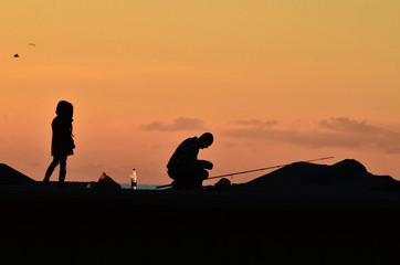 fishermen at sunset