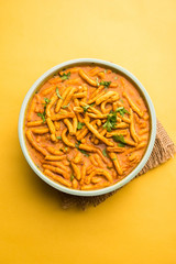Dhaba style Sev bhaji/sabzi/curry made in tomato curry with gathiya shev, served in a bowl or karahi, selective focus