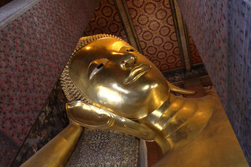 Large reclining Buddha at Wat Pho temple in Bangkok, Thailand on June 15, 2019.