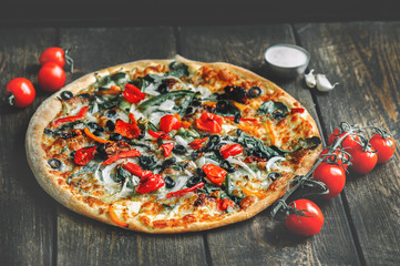 Delicious fresh pizza served on wooden table