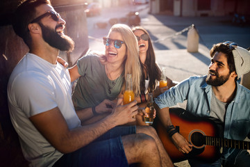 Happy young people having fun spending good time together