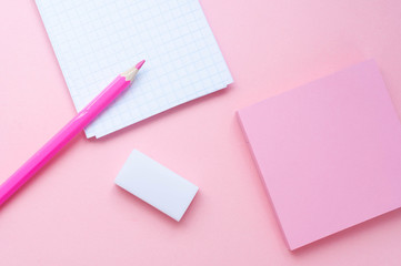 Notepad and pencil on color background
